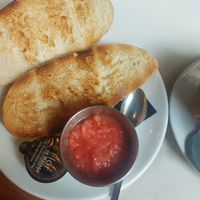 Bread with oil and tomato at Isolina  in Malaga
