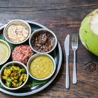Thali with Indian delicious dishes, chutneys, papadam at Samadi Kitchen Lab in Canggu