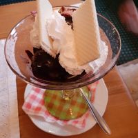 Big vegan oreo coupe with black chocolate and strawberry icecream with vegan wipped cream. at Traditionsgasthof Weissbacher in Wildschonau