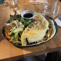 Vegan mushroom-filled pancake + expensive cup of hot water!  at Vega No Vega in Rotterdam