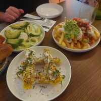 Salad, corn ribs and loaded fries at La Bohemia in Fitzroy