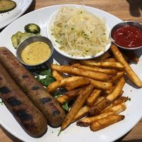 Vegan Hamburg Sausage Plate (w/ German fries & Sauerkraut) at Kiez Küche & Beer Garden  in Los Angeles