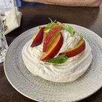 Pavlova with peaches at Mauvaise Herbe in Marseille