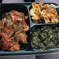 Takeout of eggplant parm entree with roasted cauliflower and spinach as sides. *chefs kiss* at ELife in Washington