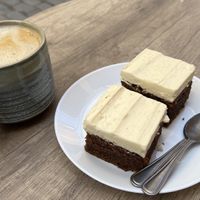 Oat latte and morotskaka (carrotcake).  at Bacchi Syre  in Stockholm