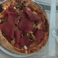 Pizza capricciosa at Swami's Garden in Praia Da Luz