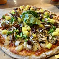 Vegan pizza with vegan cheese, veggies and pineapple (customizable)  at Pancake Rocks Cafe in West Coast