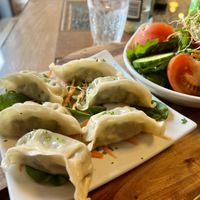 Dumplings filled with bok choy. Ask without the honey soy sauce to make it vegan.  at Pancake Rocks Cafe in West Coast