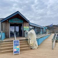 Exterior (more outdoor seating on the deck upstairs)   at The Venus Cafe - Broadsands in Paignton