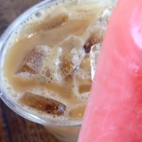 Almond milk iced latte with local Ceremony Coffee and a pop- strawberry ginger lemonade at Pleasant Pops in Washington