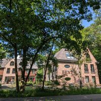 Restaurant in the left building, rooms in the right building at HOTEL BENT Restaurant in Oisterwijk