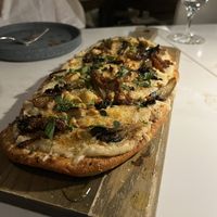 Shiitake Maitake Flatbread. This was a last-minute addition to the meal, and I’m so glad we got it! It ended up being my favorite dish.  at Reverie Restaurant and Cocktail Bar in Brooklyn