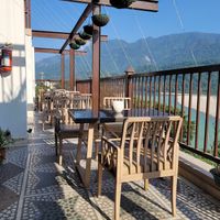 Outdoor terrace seating at The Sitting Elephant in Rishikesh