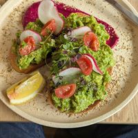 Smashed avo at Gather & Grounds Cafe  in Glenelg