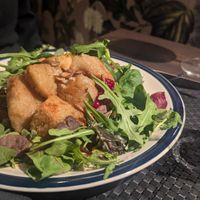 Potato dumplings with berries, apples and grilled vegetables at ÖUR in Stockholm