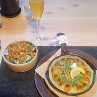 "Fish" stew with accompanying side salad, lunch option at ÖUR in Stockholm