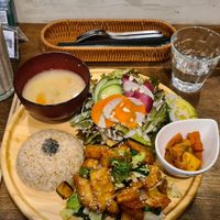 Plate with the Japanese style "meat." With extra salad and avocado 🥑 topping, plus a tasty big smoothy on the side. at Paprika Shokudo Vegan in Osaka