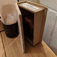 Push the button inside the book/box to call the server.  at Paprika Shokudo Vegan in Osaka