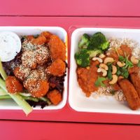 Buffalo cauliflower wings with vegan ranch dressing, and a small tikka masala bowl (coconut, vegetable and chick pea curry, steamed broccoli, chick’n tenders, roasted cashews, and cilantro served over rice). Photo taken June 2018. at Fresh on Eglinton in Toronto