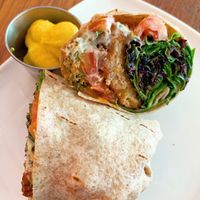 Buffalo Chicken Wrap with a side of V cheese sauce  at Fresh on Eglinton in Toronto