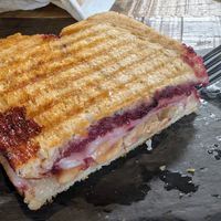 Honee and berry jam-brie vegan panini was delicious, the crunch of the almonds was perfect at Let it Brie in Fullerton