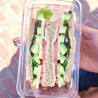 Avocado, cucumber, tomato, and chipotle 'cheese' sandwich on sprouted grain bread. at Cocobeet in Boston