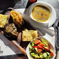 Vegan platter (soup, salad, pie, stuffed aubergine and stuffed bell pepper) at Genti Breakfast & Restaurant in Shkoder