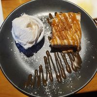 Lotus Biscoff cheesecake served with butterscotch sauce and vegan ice cream at Plough and Flail in Knutsford