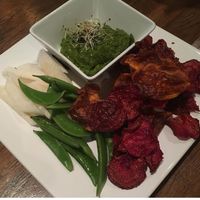 Curried spinach dip with jicama, beet chips, and peas at Nosh Eatery and Tap in Saskatoon