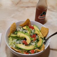Bean and rice bowl topped with lettuce and avocado at Mama Mayra's Kitchen in Eugene