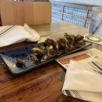 Agave bourbon brussel sprouts, literally amazing and vegan as is!!!  at Oak & Stone in Estero