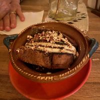 This was dessert; banana bread with a coconut sauce finished with a light decorative touch of fire!  at Cósmica Cocina  in Puerto Vallarta