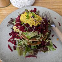 Savory pancake stack on a different visit at New Earth Cafe in Coolum Beach