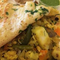 Yellow lentil dosa with cauliflower filling at DC Dosa - Kiosk in Washington
