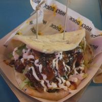 Vegan shredded duck, flatbread with hoisin sauce, cucumber, lettuce, spring onions and sesame seeds. at Holy Duck (Stack Lincoln) in Lincoln