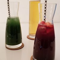 Matcha ginger iced tea, red berry iced tea, and a local beer at The Green Garden in Salzburg