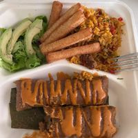 Impossible beef pasteles, rice, yuca fries and salad. at Planteles Plant-Based  in Secaucus