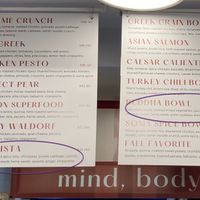 Wall menu, with vegan items highlighted at Soma Salads  in New York City