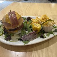 Burger with BBQ sauce, vegan cheese, vegan bacon, caramelized onions, corn, mac n cheese  at Lily Burger in Berlin