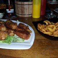Vegan chicken wings and curly fries. at Lily Burger in Berlin