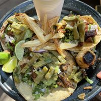 Delicious tacos and salsas! Don’t miss out on that little roasted onion! It’s a vibe in itself.  at Por Siempre Vegana - Food Stall in Mexico City