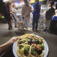 You can sit on a small little ledge by the stand and eat  at Por Siempre Vegana - Food Stall in Mexico City