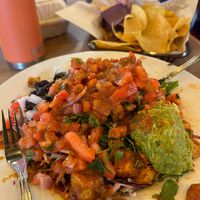 Salad loaded up with tofu and Sweet Chipotle sauce. All orders come with complimentary chips at Mucho Gusto  in Eugene