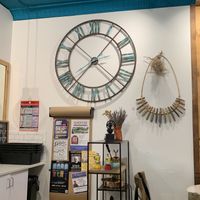 Interior shot with coffee trinkets and a non-functional giant blue wall clock to give a sense of the atmosphere  at LOKL CAFE in Morristown