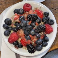 Vegan Bircher muesli bowl with berriess  at A Never Ever Ending Love Story in Berlin