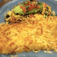 Farmhouse omelette - I took out the zucchini and bell pepper but still loaded with veggies. Not pictured - sourdough bread that comes dry, I spread it with avocado!    at The Breakfast Club in Livermore