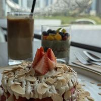 Strawberry pancakes, overnight matcha chia pudding, soy milk lattee  at Leen's - Emirates Office Tower in Dubai