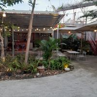 Inside is a large open aired restaurant at Xóm • Chay & cà phê in Ho Chi Minh City