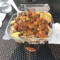 Vegan loaded nachos - not the prettiest but very delicious!! Eggplant queso, chili, and avocado  at Press'd - Plant Street Market in Winter Garden