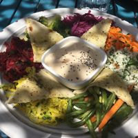 Mezze plate : vegetables and hummus in the center at House of Wonders in Cascais